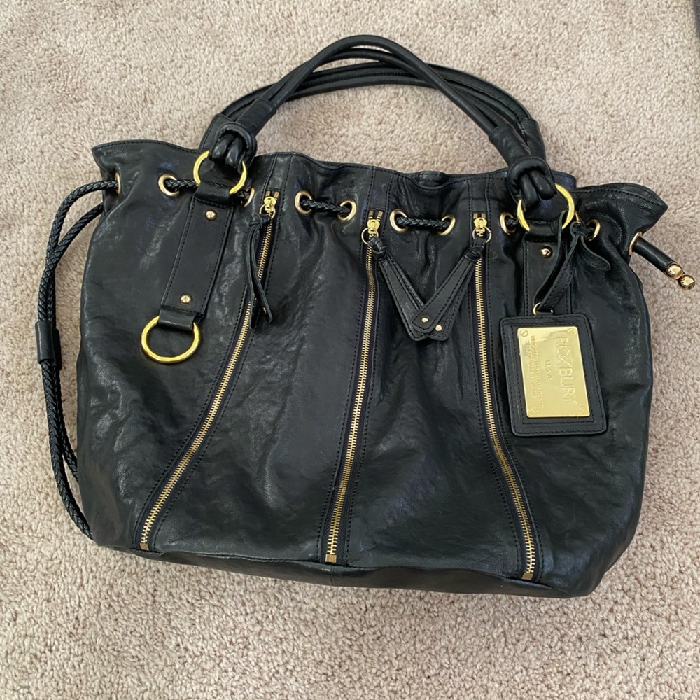 Elegant Roxbury Black Shoulder Bag with Gold Accents, comes with original bag